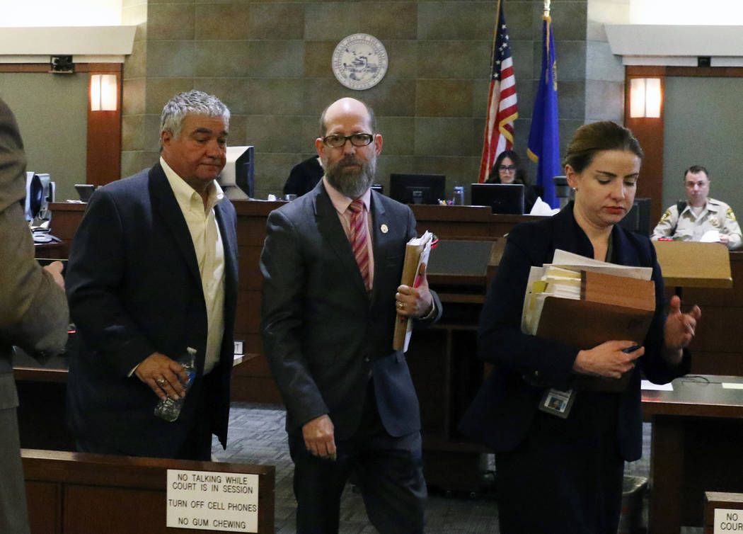 Former Henderson Constable Earl Mitchell, left, leaves the courtroom with his attorney David Fi ...