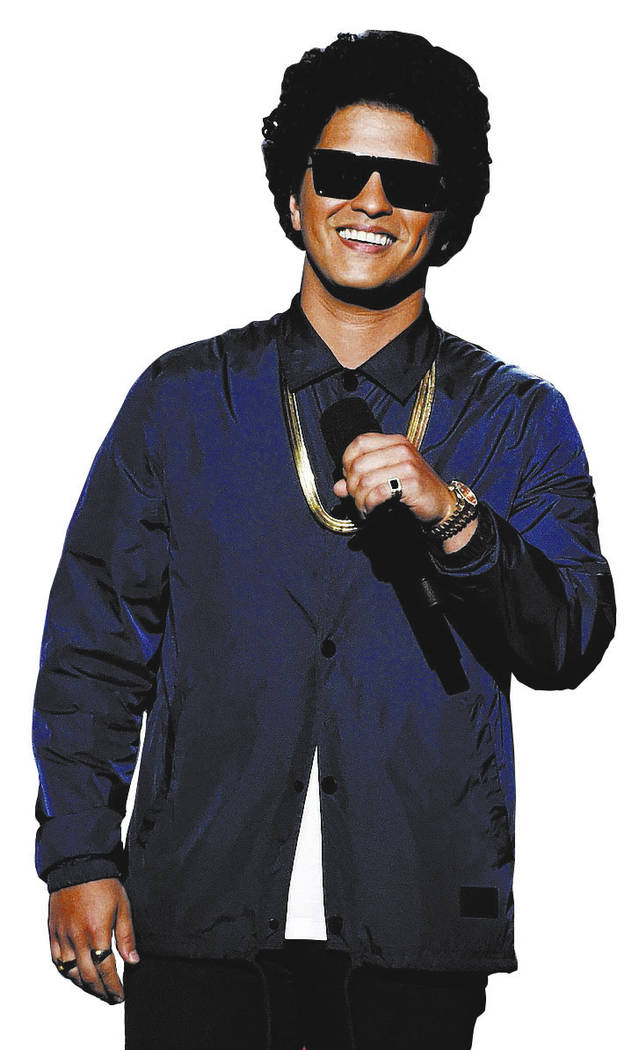 FILE - In this May 20, 2018, file photo, Bruno Mars presents the Icon award at the Billboard Mu ...