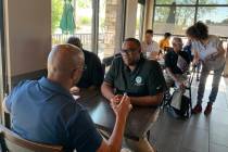 Las Vegas City Councilman Cedric Crear speaks with an attendee at his Coffee with Councilman Cr ...
