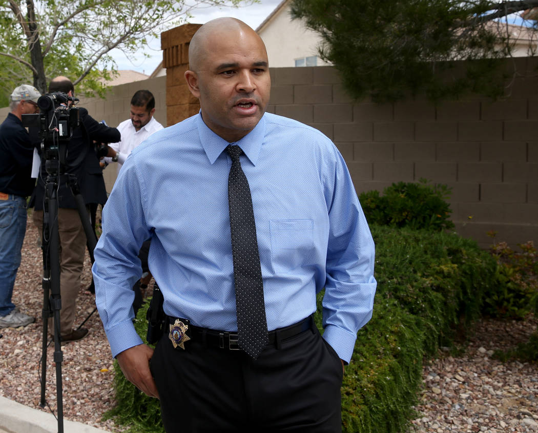 Las Vegas police homicide Lt. Ray Spencer talks to a reporter regarding a shooting in a gated c ...