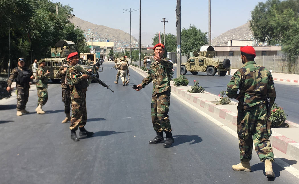 Afghan security forces arrive at the site of an explosion in Kabul, Afghanistan, Monday, July 1 ...