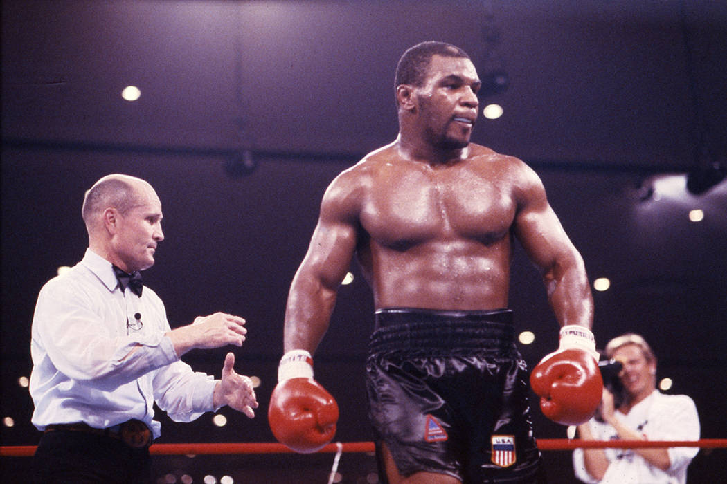 Undefeated Mike Tyson defeated Tony Tucker in a unanimous 12-round decision and he became the u ...
