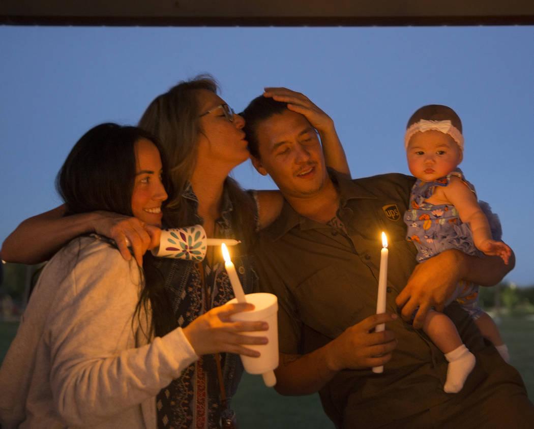 Ashley Andrade, left, Kerrie Mendoza, Nick Andrade and Alivia Andrade, 6 months old, comfort ea ...