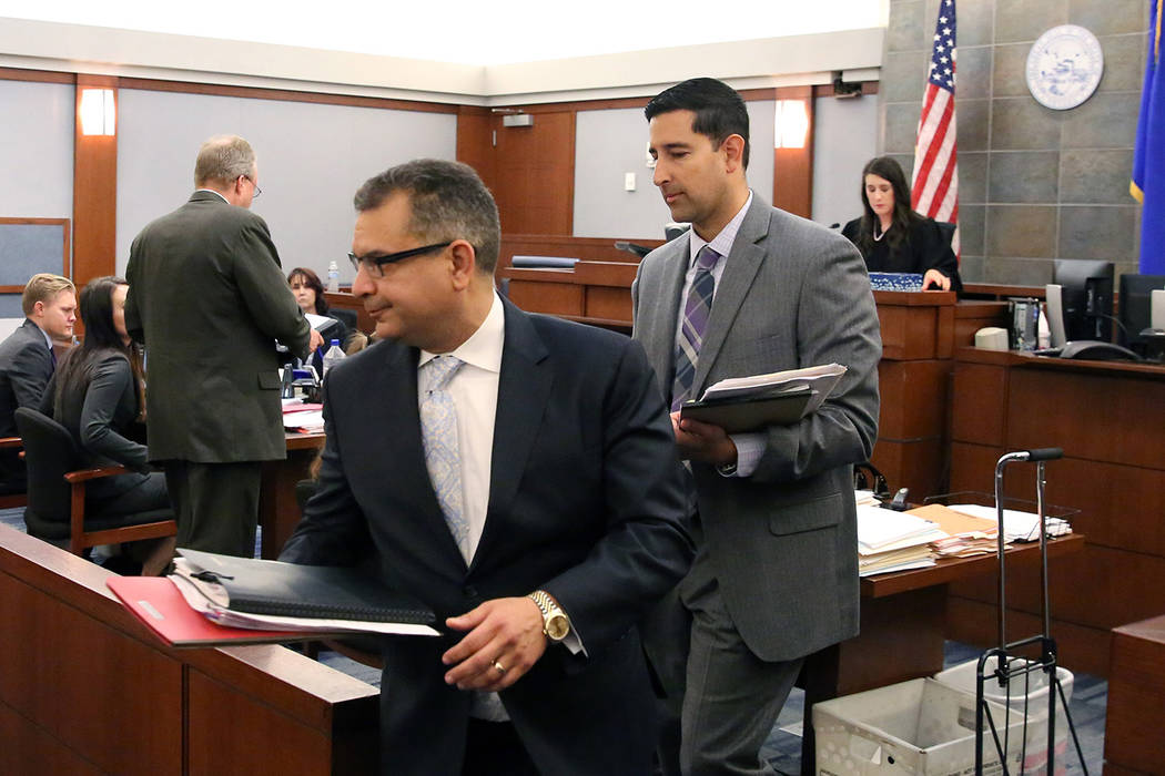 Defense lawyer Christopher Oram, left, who represents former LVCVA executive Brig Lawson, and C ...