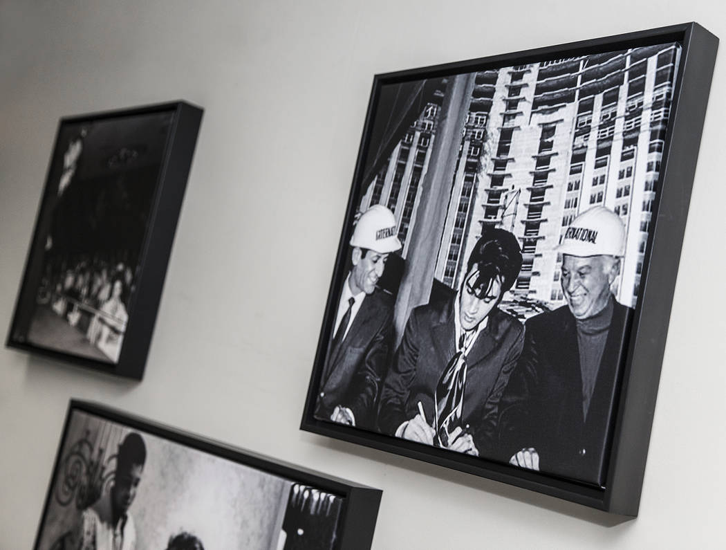 Prints of famous photographs of Elvis Presley hang on the wall in the administrative offices of ...