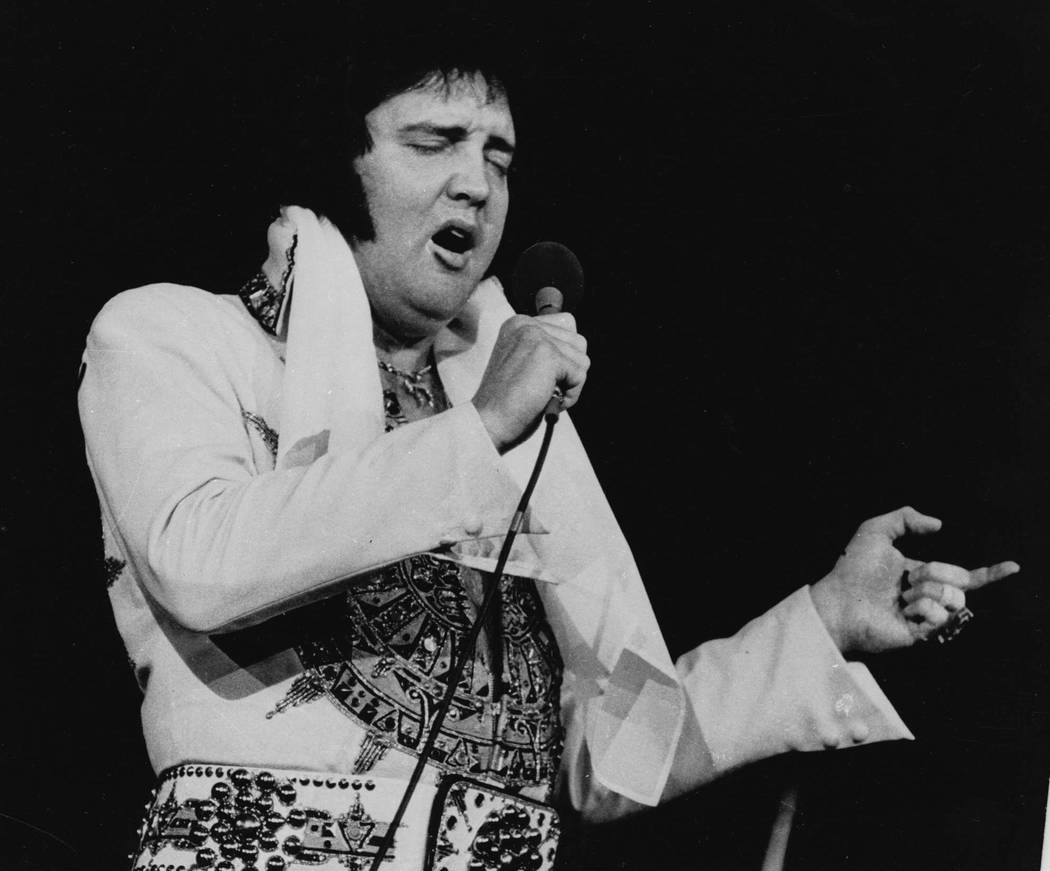 Elvis Presley is shown performing in Providence, R.I. on May 23, 1977, three months before his ...