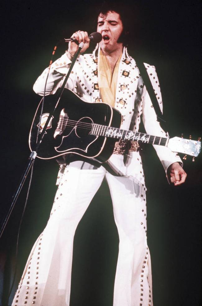 Elvis Presley sings during a 1973 concert. (Associated Press file)