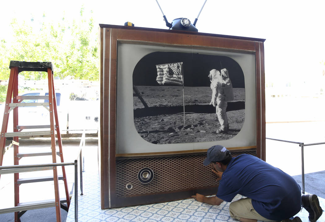 Dave Bailey works on "Apollo Moon Landing 50th Anniversary" float during a media preview of the ...