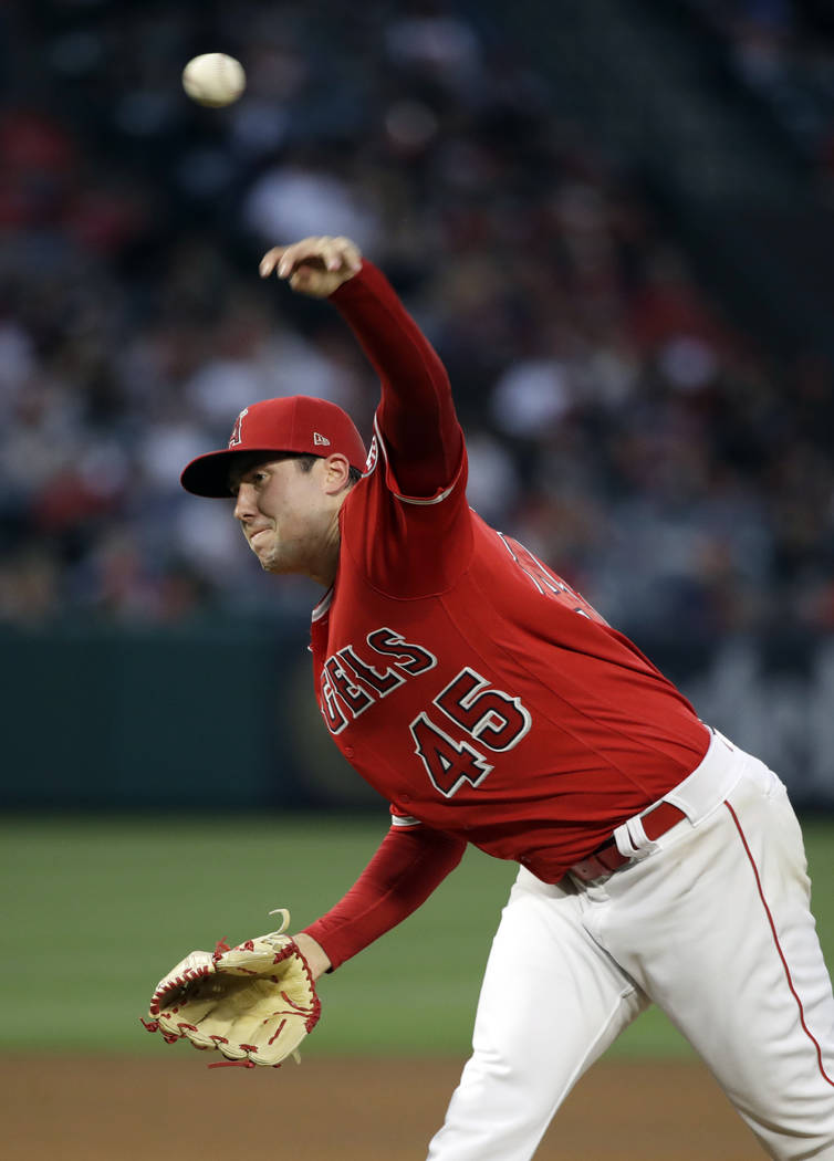 Los Angeles Angels starting pitcher Tyler Skaggs throws to an Oakland Athletics batter during t ...