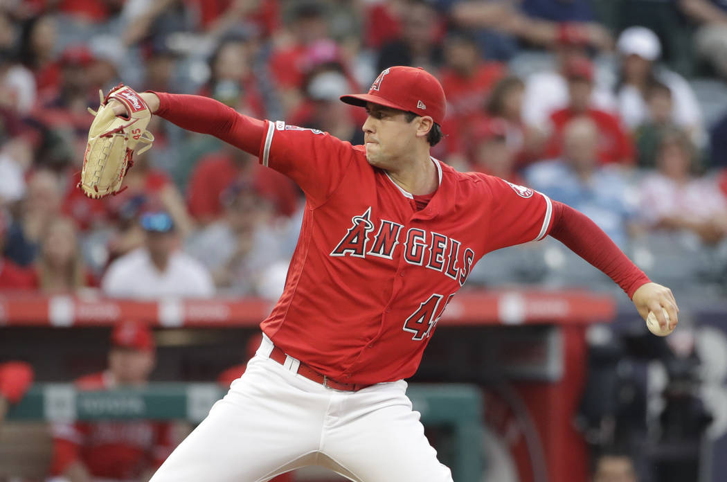 Los Angeles Angels starting pitcher Tyler Skaggs throws to the Oakland Athletics during the fir ...