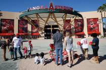 Los Angeles Angel mourners stand at a memorial to give their condolences for pitcher Tyler Skag ...