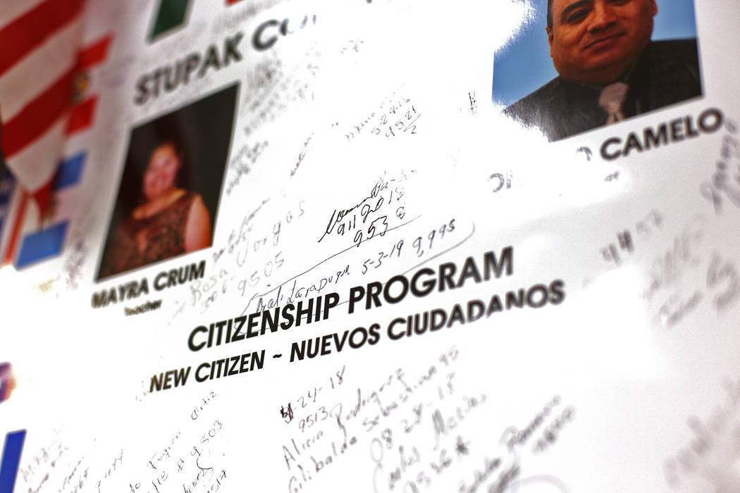 A board with signatures from students who earned their citizenship at the Stupak Community Cent ...