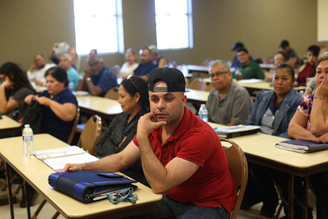 Walter Salguero, originally from Guatemala, answers questions at a citizenship class at the Stu ...