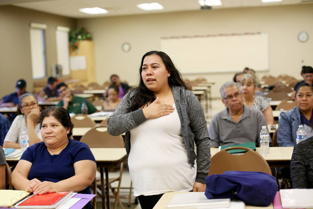 Adriana Bolanos practices the pledge of allegiance at the city's citizenship class at the Stupa ...