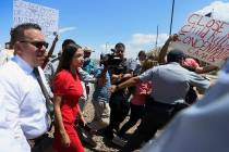 U.S. Rep. Alexandria Ocasio-Cortez, D-New York, is escorted back to her vehicle after she speak ...