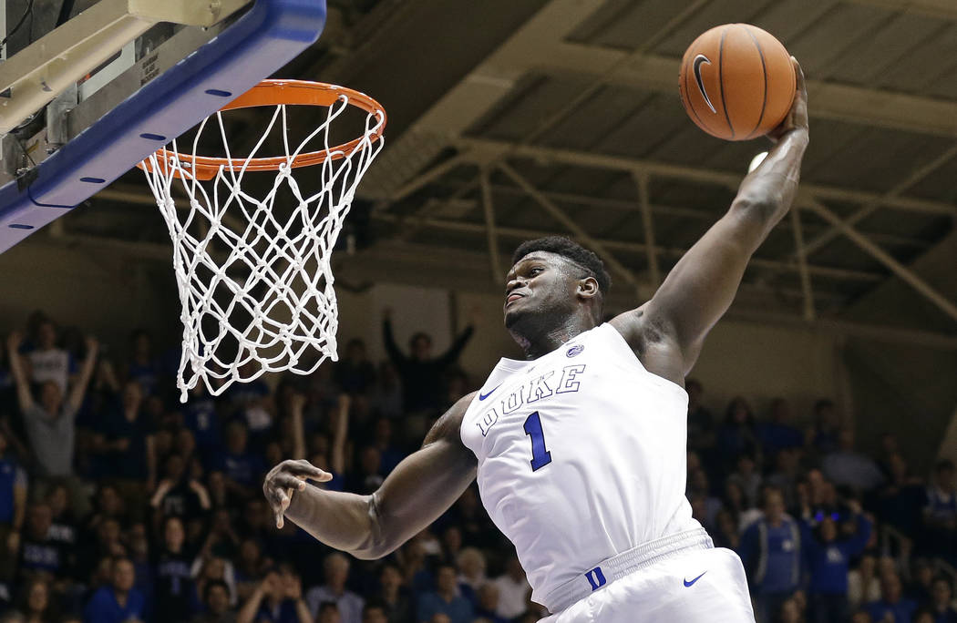 In this Jan. 5, 2019, file photo, Duke's Zion Williamson (1) dunks during the second half of an ...