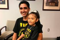 Jose Escobar poses with his daughter Carmen shortly after returning to the United States at Hou ...