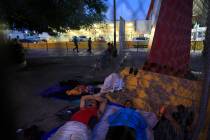 A small group of migrants waiting to seek asylum sleeps at the entrance to the Puerta Mexico in ...