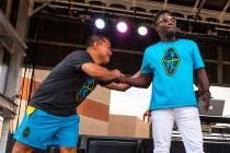 Las Vegas Lights FC assistant head coach Auggie Rodriguez, left, greets hype man Robert "Bojo" ...