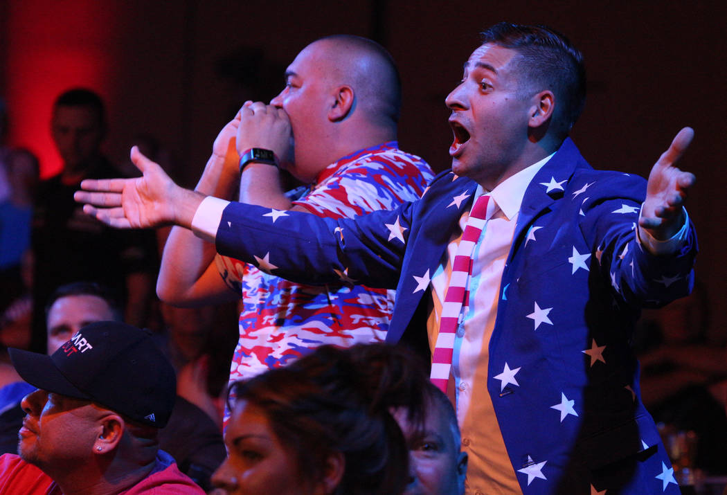 Tony Smeland, left, from Virginia, and Michael Weyant, from Arizona, cheer during the 2019 Dafa ...