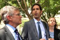 FILE - In this June 11, 2019 file photo Scott Warren, center, speaks outside federal court, in ...