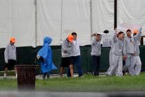 Migrant children walk on the grounds of the Homestead Temporary Shelter for Unaccompanied Child ...