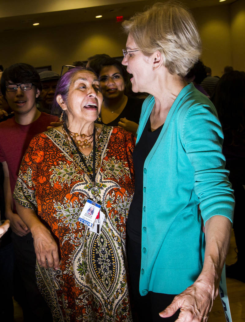 Vicenta Montoya, left, greets Democratic presidential candidate Sen. Elizabeth Warren, D-Mass., ...
