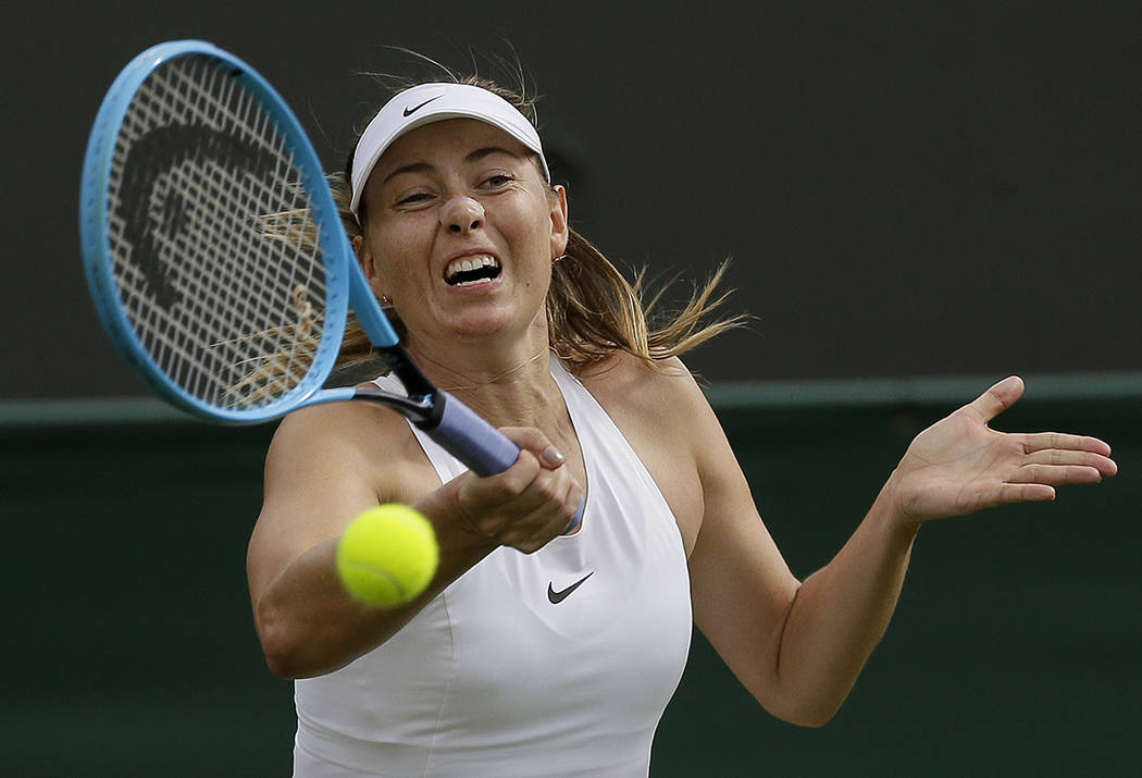Russia's Maria Sharapova returns to Pauline Parmentier of France in a Women's singles match dur ...