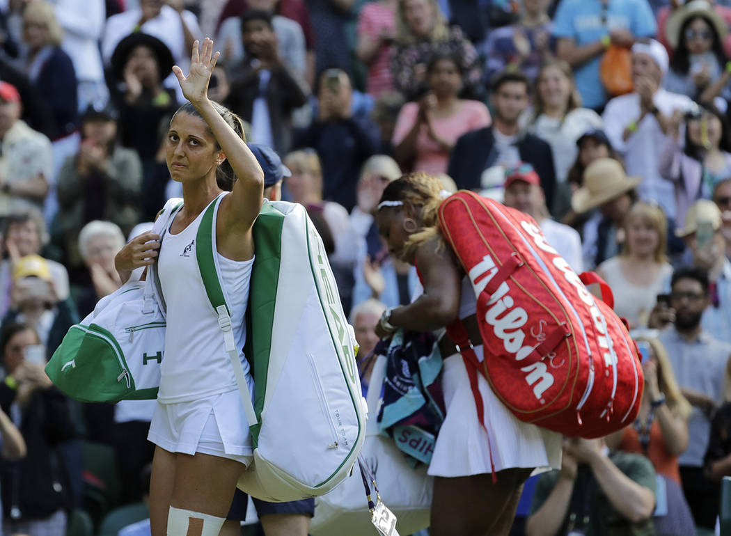 Italy's Giulia Gatto-Monticone, left, waves as she leaves the court after losing to United Stat ...