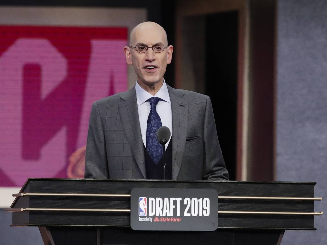 NBA Commissioner Adam Silver announces Vanderbilt's Darius Garland as the fifth pick overall by ...
