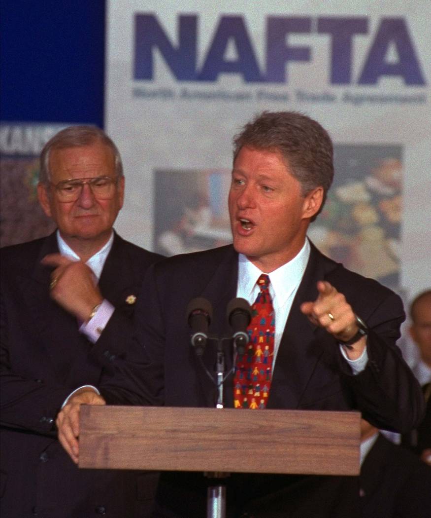 President Clinton with Lee Iacocca, the former chairman of the Chrysler Corporation at his side ...