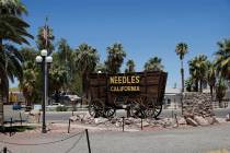 In this June 27, 2019, photo, a sign adorns an historic wagon along the old Route 66 in Needles ...