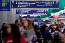 In this Nov. 21, 2017, file photo, passengers walk in Terminal 3 at O'Hare airport in Chicago. ...