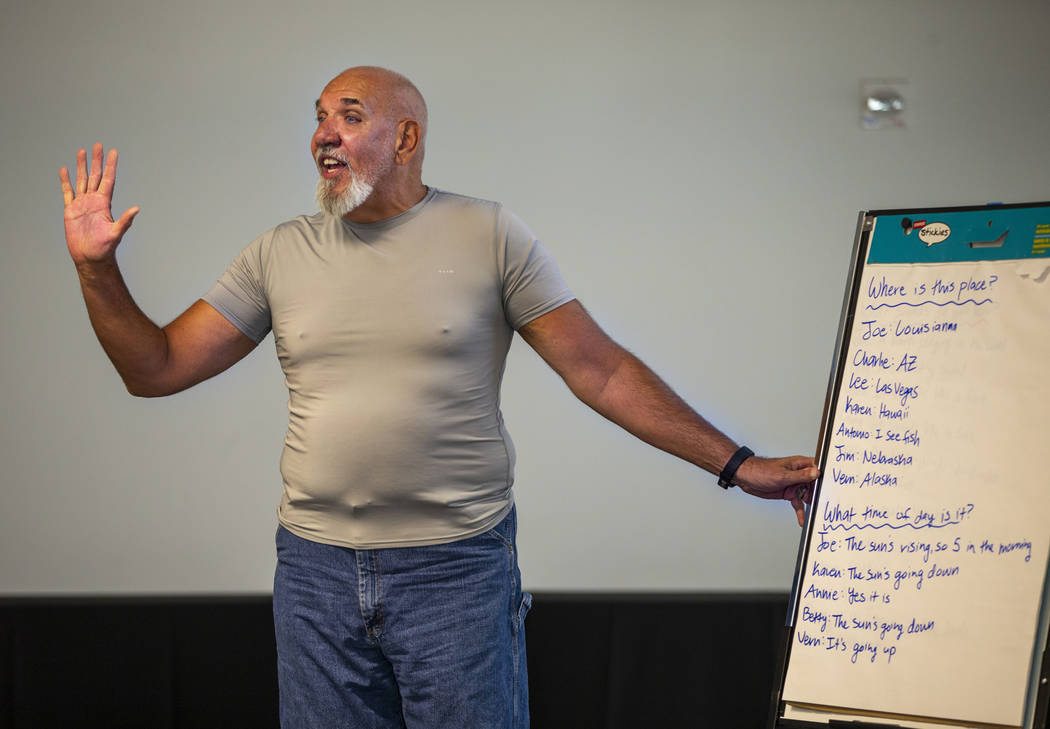 Volunteer Jay Nagle leads a group story amongst songs, exercises and more during a Memory Cafe ...