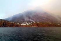 Smoke billows from the volcano on the Italian island of Stromboli, Wednesday, July 3, 2019. The ...