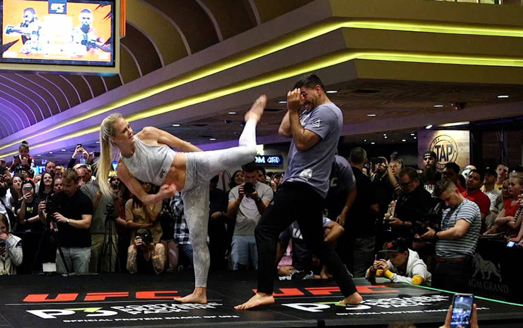 UFC bantamweight contender Holly Holm launches a kick at the open workouts at the MGM Grand hot ...