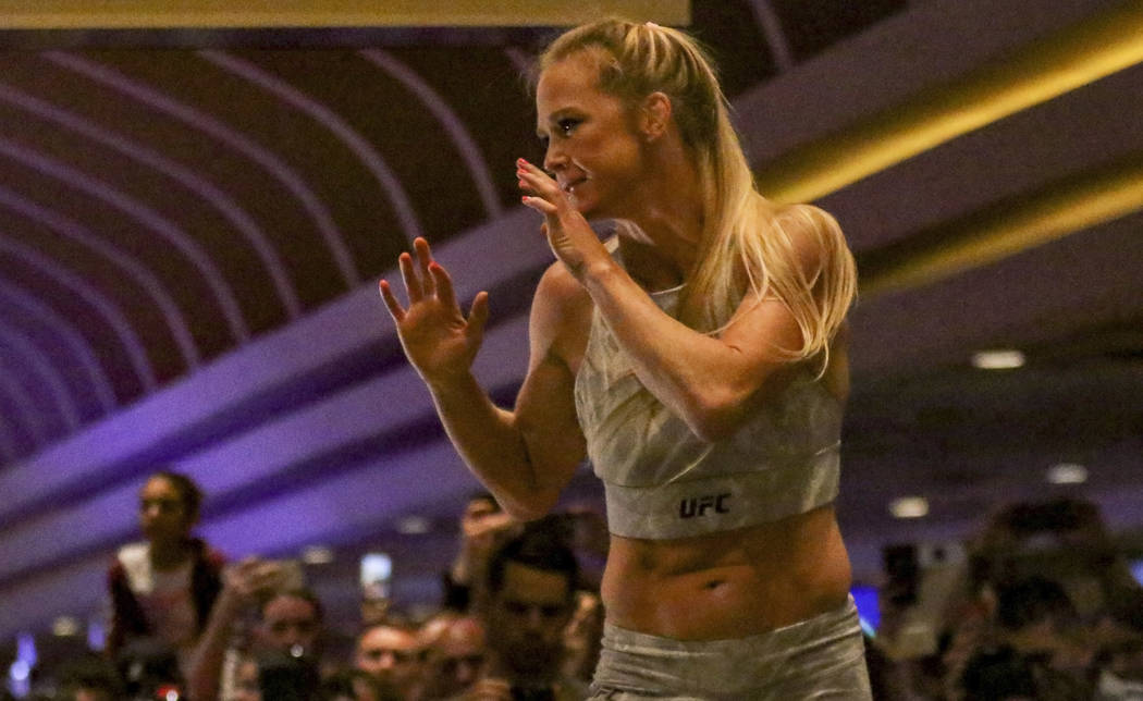 UFC women's bantamweight competitor Holly Holm warms up at the open workouts at the MGM Grand h ...