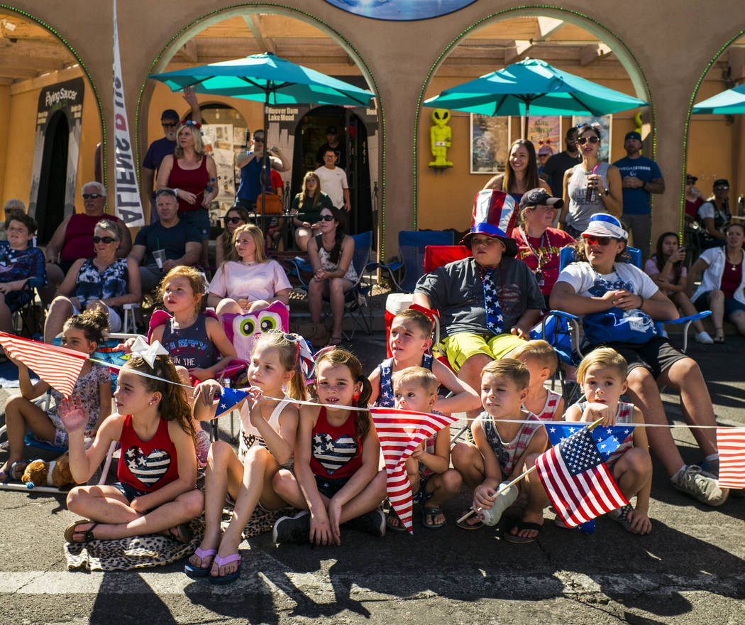 Young spectators watch parade participants pass by at the annual Damboree Celebration in Boulde ...