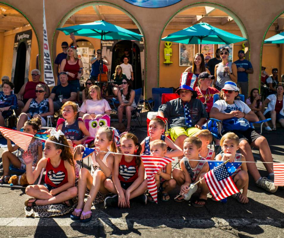 Young spectators watch parade participants pass by at the annual Damboree Celebration in Boulde ...