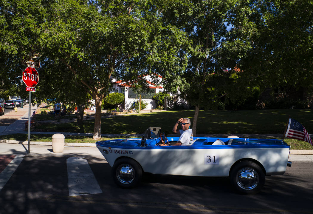 Boulder City resident Kevin Savord drives is boatcar before participating in the parade at the ...
