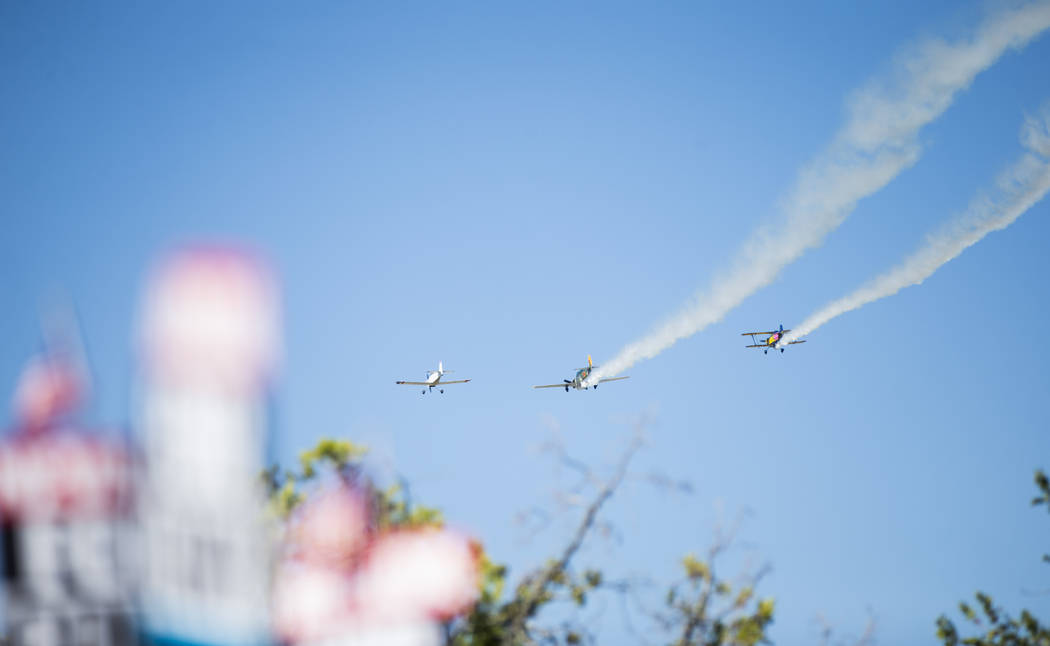 Planes manned by members of the Boulder City Veteran's Flying Group fly overhead during the par ...