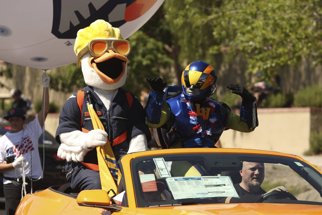 Las Vegas Aviators mascots wave at spectators during the 25th annual Summerlin Council Patrioti ...