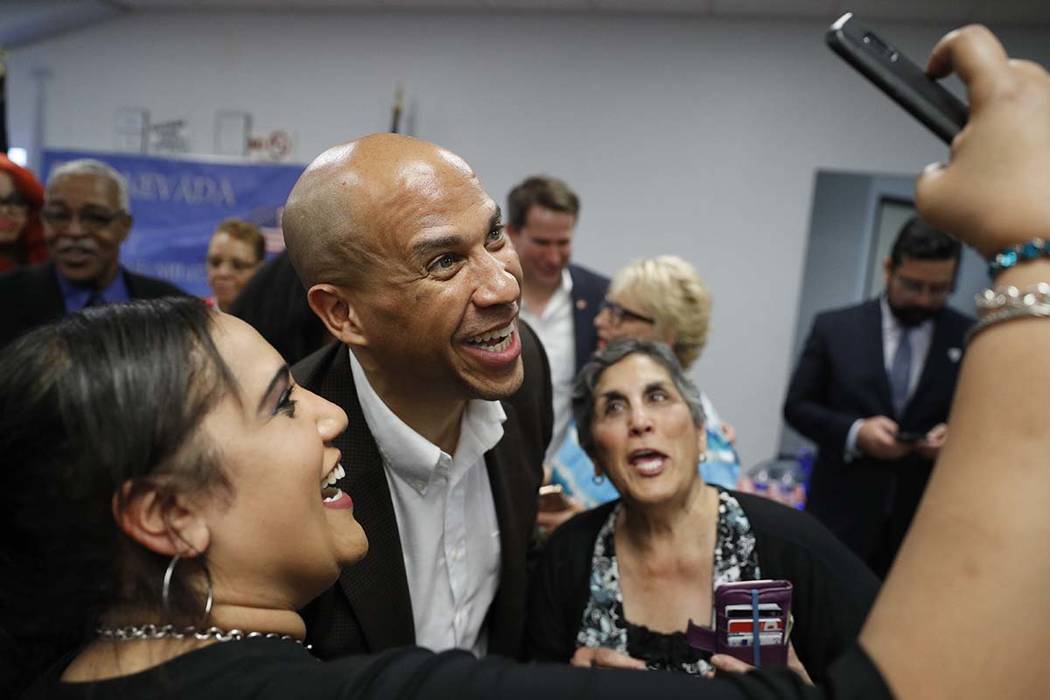 Democratic presidential candidate Sen. Cory Booker poses for a selfie during an event at a Vete ...