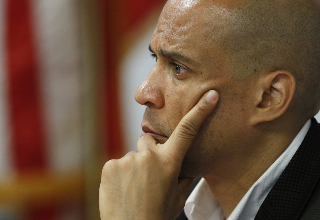 Democratic presidential candidate Sen. Cory Booker listens during an event at a Veterans of For ...