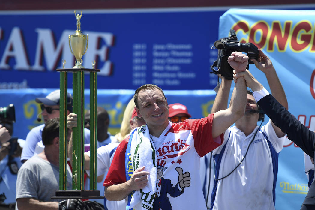 Joey Chestnut reacts after winning the men's competition of Nathan's Famous July Fourth hot dog ...