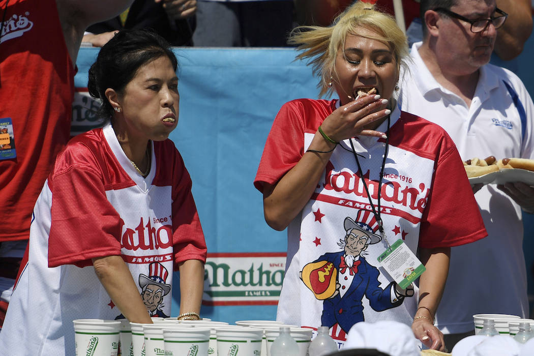 Juliet Lee, left, and Miki Sudo, right, compete in the women's competition of Nathan's Famous J ...