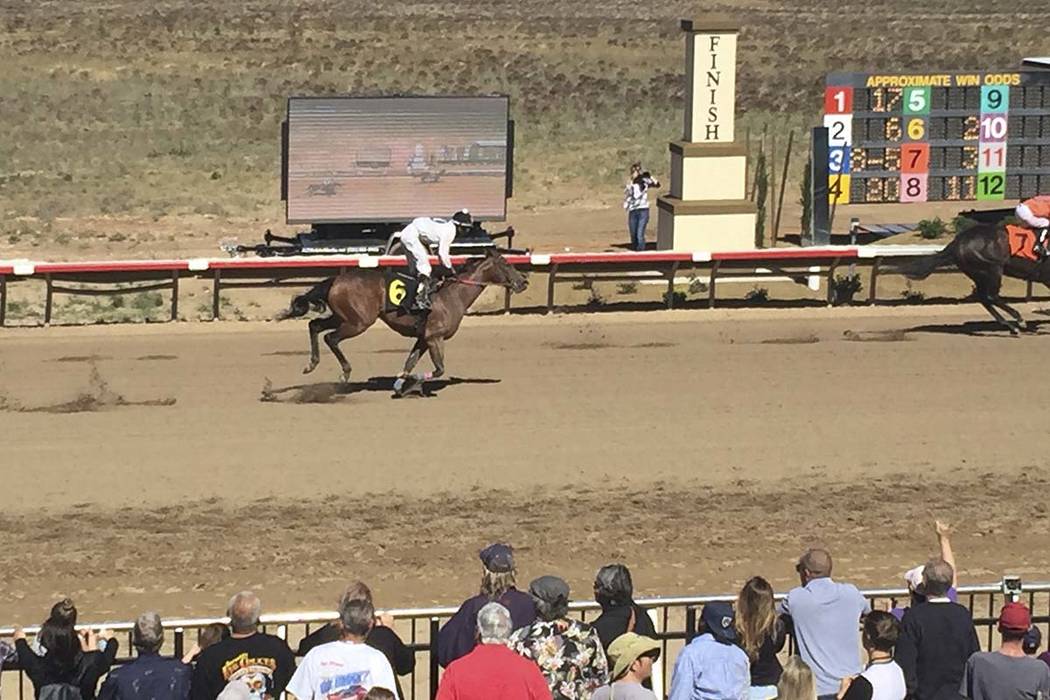 Horses race down the track at Arizona Downs in Prescott Valley, Arizona, May 25, 2019. (Mike Br ...