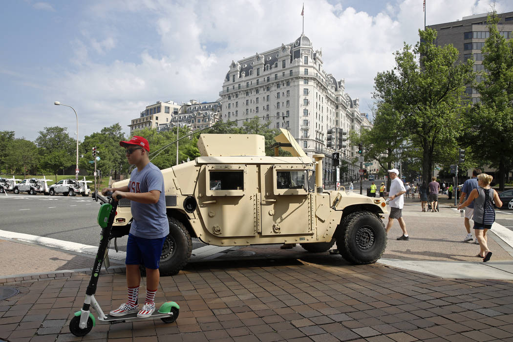 A National Guard vehicle sits parked at a security perimeter near the National Mall in Washingt ...