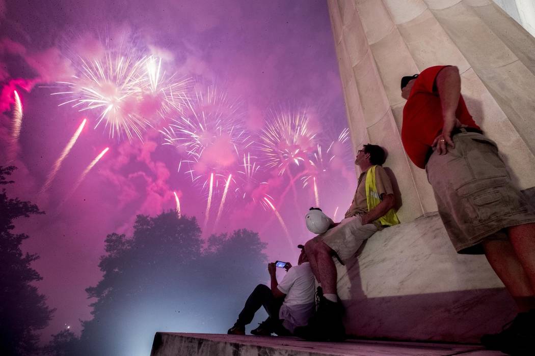 Fireworks seen from the Lincoln Memorial explode over the Potomac River for Independence Day, T ...