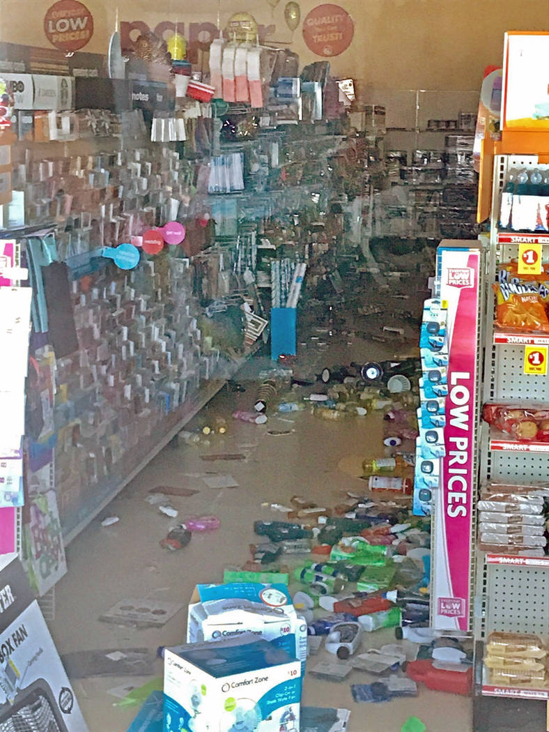 Merchandise lies on the floor at a Family Dollar store seen through a window after an earthquak ...
